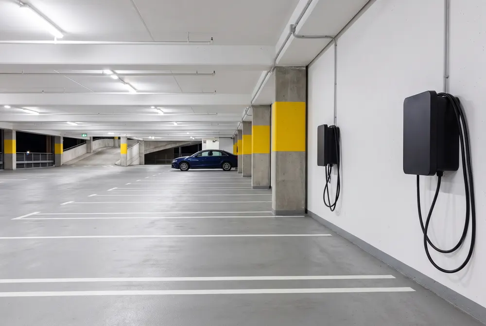 Empty parking garage level with two wall chargers